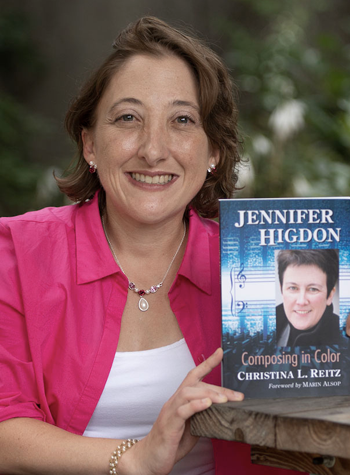 Photo of Christina Reitz holding her book 